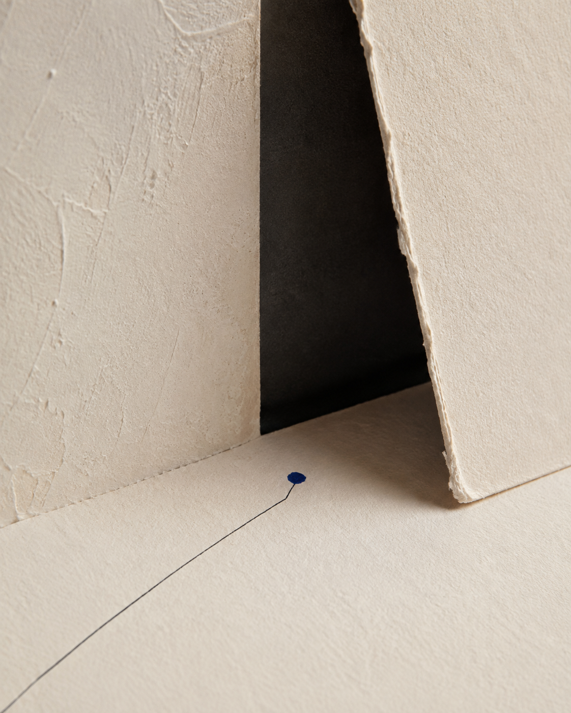 An abstract blue marker moving through an architectural paper threshold